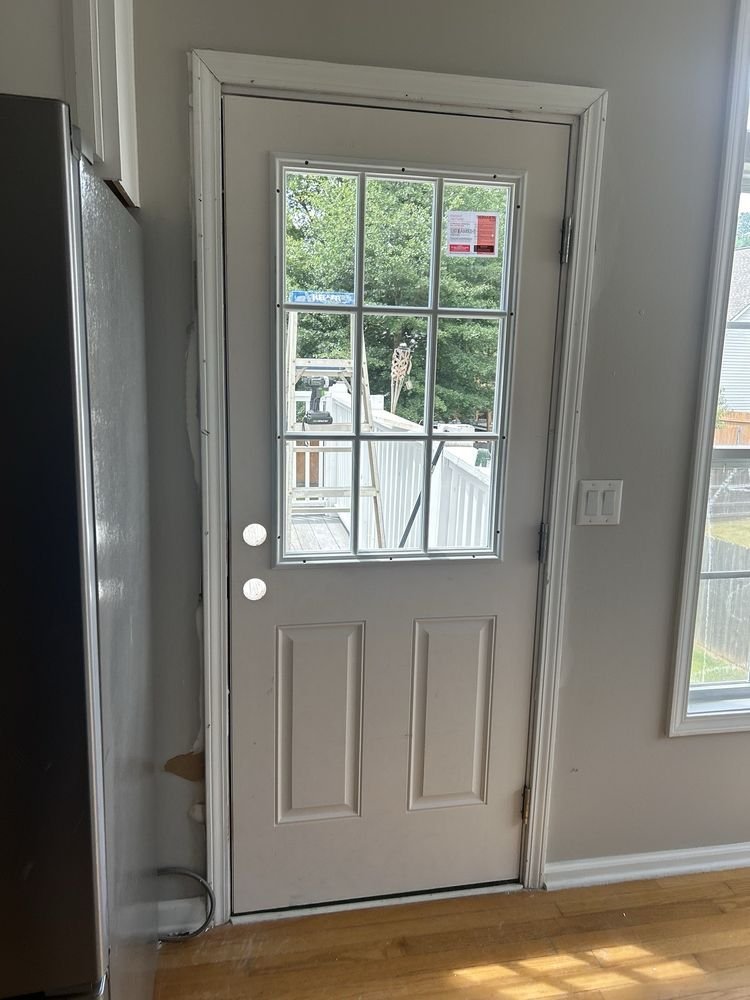 Door installation with light switch panel